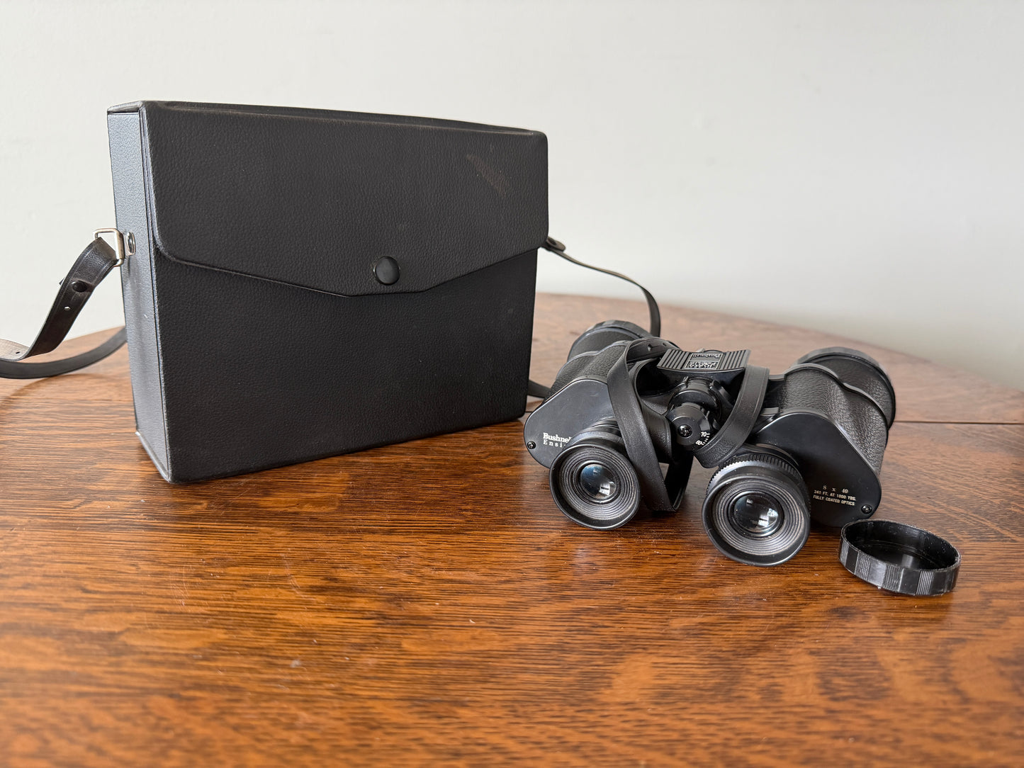 Vintage Bushnell Ensign 8x40 binoculars featuring Insta-Focus adjustment and fully coated optics.