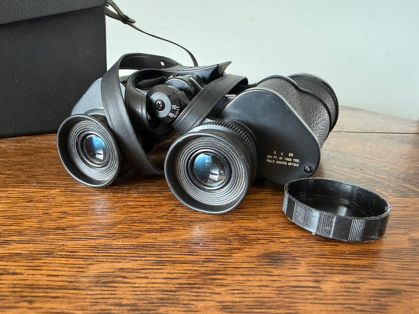 Vintage Bushnell Ensign 8x40 binoculars featuring Insta-Focus adjustment and fully coated optics.